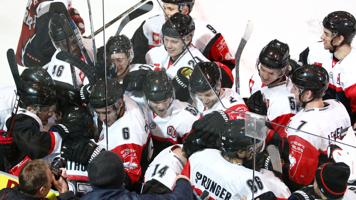 Fribourg's Yannick Rathgeb (center, hidden) celebrates his winning goal with team mates during the ice hockey Champions League match 1/8 Final between HC Fribourg-Gotteron and KalPa Kuopio of Fin ...