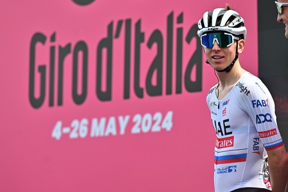 epa11319454 Slovenian rider Tadej Pogacar of UAE Team Emirates looks on during the sign in ahead of the second stage of the Giro d&#039;Italia 2024, a 161km cycling race from San Francesco al Campo to ...