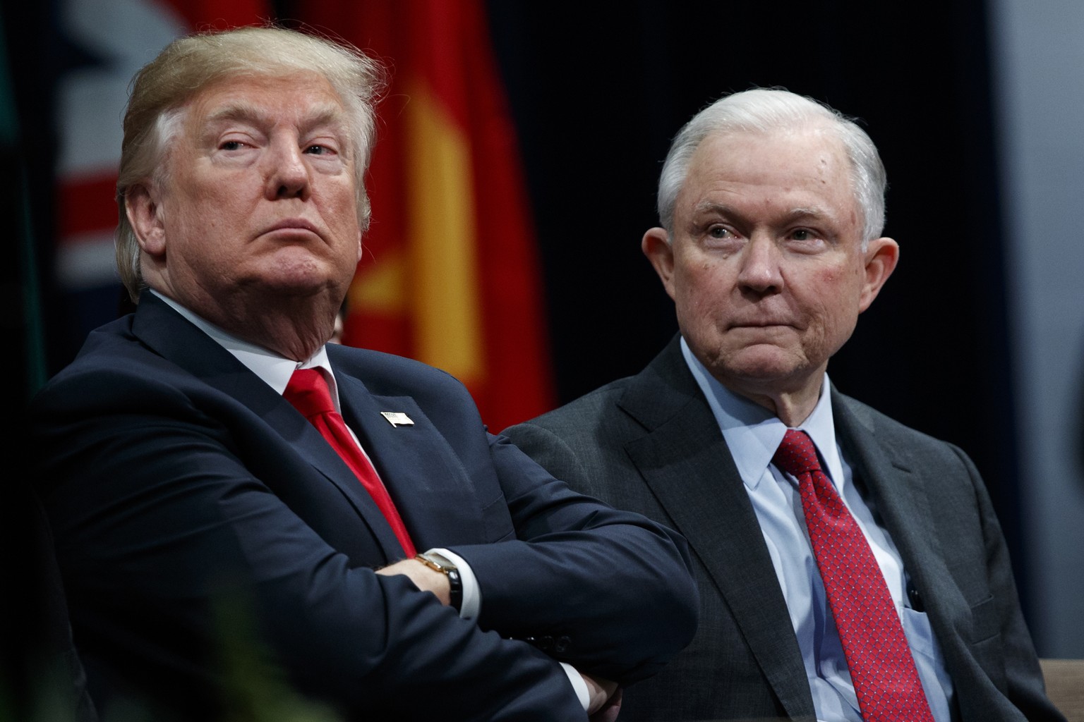 FILE - In this Dec. 15, 2017 file photo, President Donald Trump, left, sits with Attorney General Jeff Sessions during the FBI National Academy graduation ceremony in Quantico, Va. Trump is still roil ...