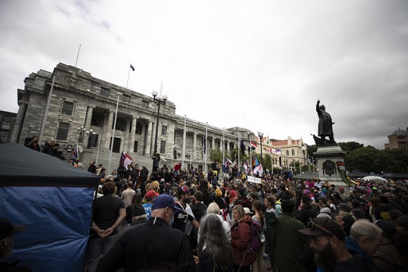People who oppose vaccine mandates protest at Parliament in Wellington, New Zealand Monday, Feb. 14, 2022. The protesters are not planning to leave any time soon after they drove in convoys from aroun ...