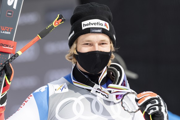 epa09081438 Second placed Marco Odermatt of Switzerland poses with his medal during the podium ceremony for the men&#039;s Super-G overall standings at the FIS Alpine Skiing World Cup finals, in Lenze ...