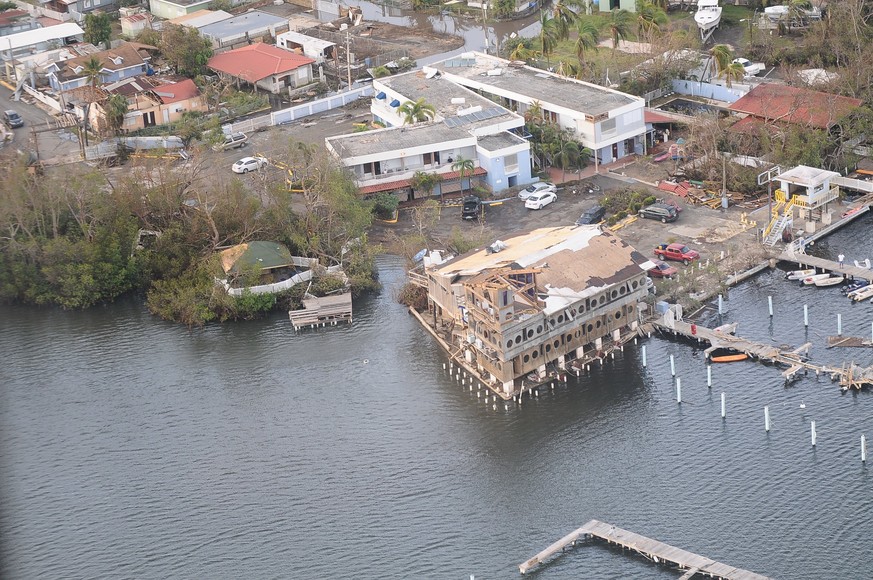 epa06233682 A handout photo made available by the Puerto Rico National Guard (PRNG) on 28 September 2017 shows an aerial view of damaged buildings in San Juan, Puerto Rico, 23 September 2017, during a ...