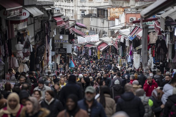 epa10431390 People walk for shopping at the Tahtakale bazaar in Istanbul, Turkey, 26 January 2023. The Turkish Central Bank&#039;s President Sahap Kavcioglu stood by previous year-end annual inflation ...