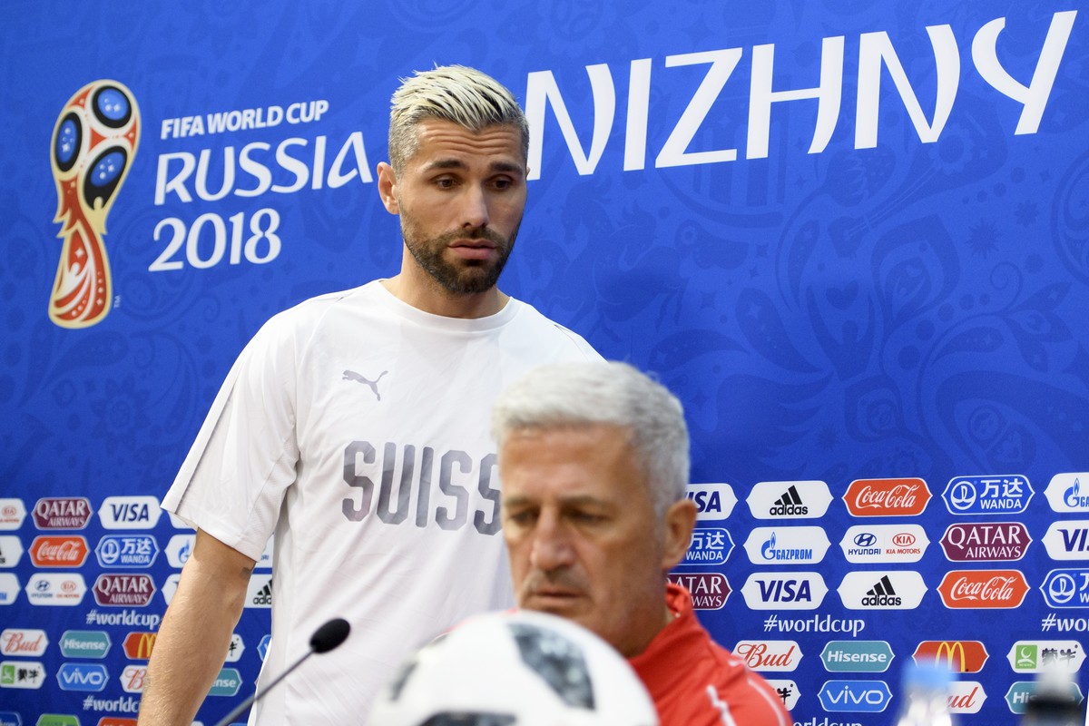 Switzerland's midfielder Valon Behrami, left, and Switzerland's head coach Vladimir Petkovic, right, arrives for a press conference on the eve of the FIFA World Cup 2018 group E preliminary  ...