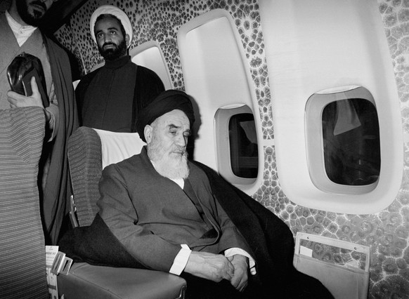 FILE - In this Feb. 1, 1979, file photo, Ayatollah Ruhollah Khomeini sits inside the chartered airplane in Paris before flying back to Iran after 14 years of exile. Shah Mohammad Reza Pahlavi had expe ...