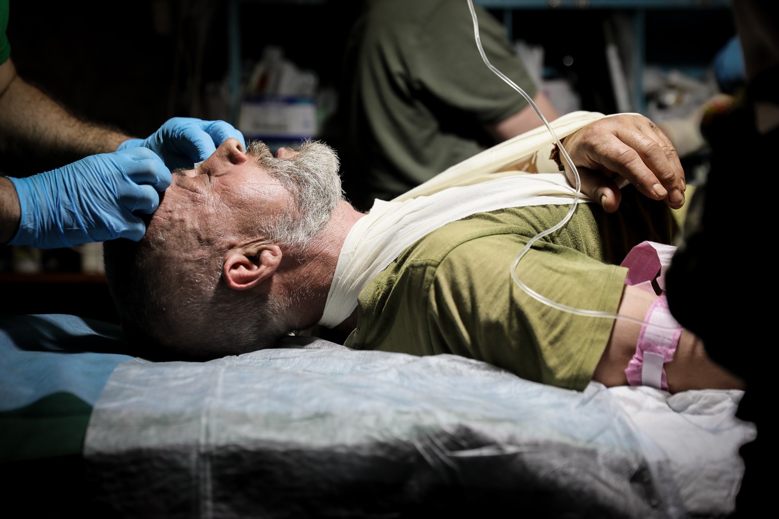 epa10754071 A Ukrainian a wounded serviceman receives treatment from Combat medics of 5th Assault brigade near Bakhmut in Donetsk region, Ukraine, 18 July 2023.The war in Ukraine, which started when R ...