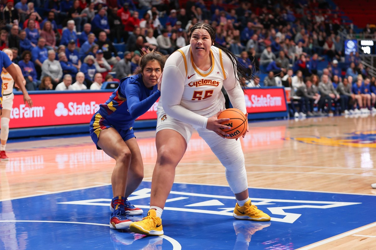 LAWRENCE, KS - FEBRUARY 15: Iowa State Cyclones center Audi Crooks 55 gets past Kansas Jayhawks forward Regan Williams 24 in the third quarter of a Big 12 womens basketball game between the Iowa State ...