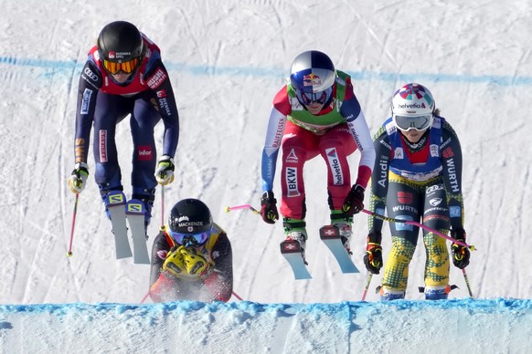 From left, Sandra Naeslund of Sweden, Brittany Phelan of Canada, Fanny Smith of Switzerland, and Daniela Maier of Germany compete during the semifinal round in women's ski cross during the FIS Ski Cross World Cup, a test event for the 2022 Winter Olympics, at the Genting Resort Secret Garden in Zhangjiakou in northern China's Hebei Province, Saturday, Nov. 27, 2021. (AP Photo/Mark Schiefelbein)