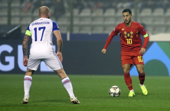 Belgium&#039;s Eden Hazard, right, vies for the ball with Iceland&#039;s Aron Gunnarsson during the UEFA Nations League soccer match between Belgium and Iceland at the King Baudouin stadium in Brussel ...