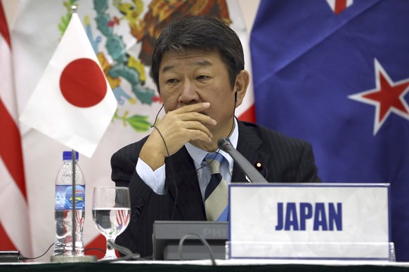 Japanese Minister of Economic Revitalization Toshimitsu Motegi listens during a press conference about the Trans-Pacific Partnership (TPP) held on the sidelines of the Asia-Pacific Economic Cooperatio ...