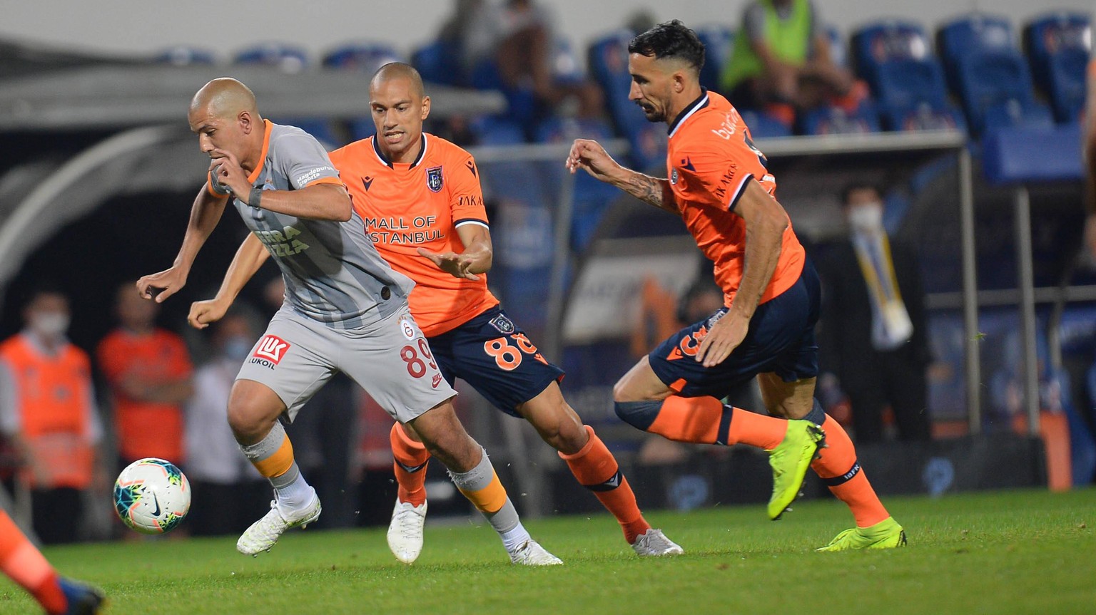 Sofiane Feghouli of Galatasaray and Gokhan Inler C , Mehmet Topal R of Basaksehir FK during the Turkish Super league football match between Basaksehir FK and Galatasaray at Basaksehir Fatih Terim Stad ...