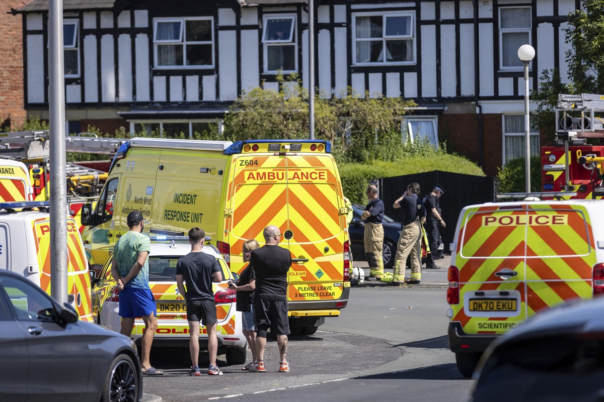 Police and emergency services arrive at the site where a man has been detained and a knife has been seized after a number of people were injured in a reported stabbing, in Southport, Merseyside, Engla ...