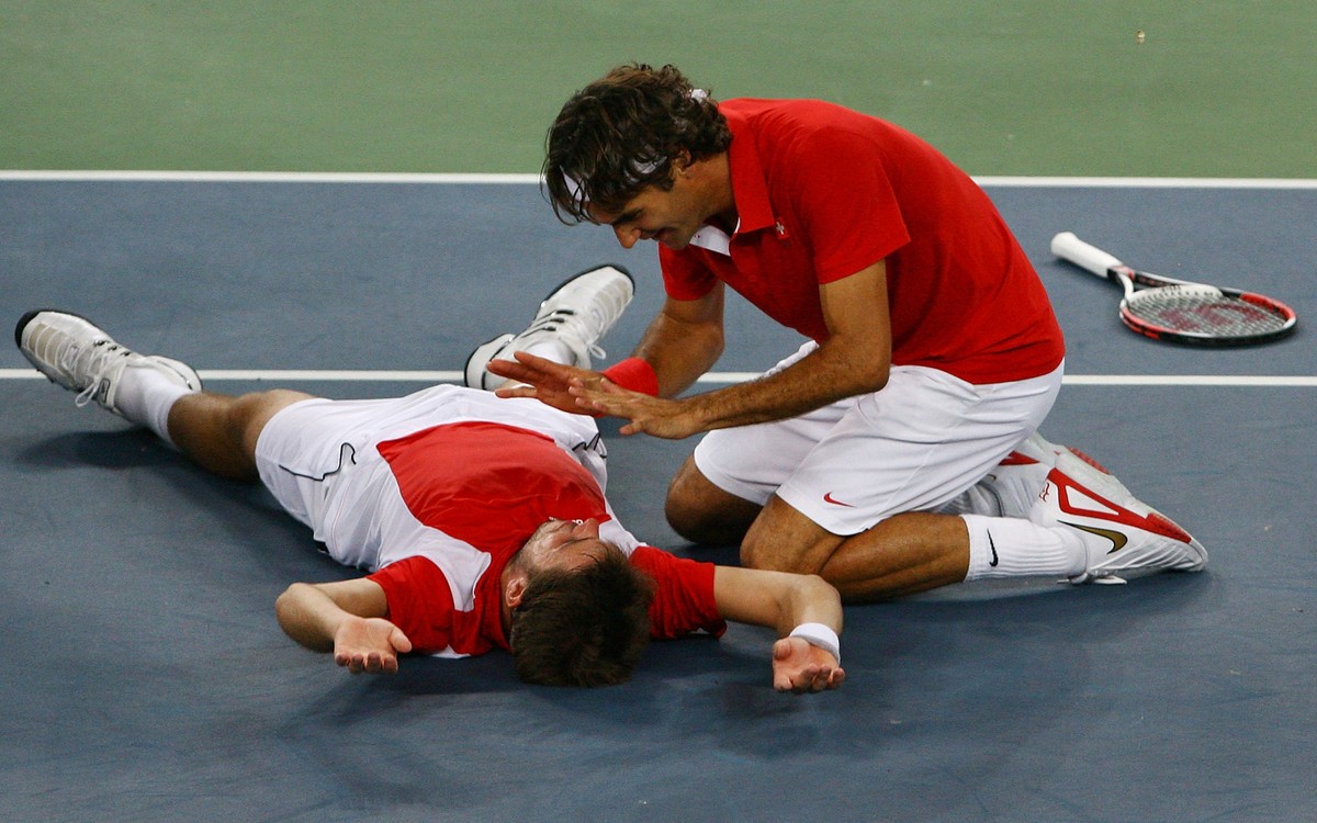 BEIJING - AUGUST 16: Roger Federer (right) and Stanislas Wawrinka of Switzerland celebrate after defeating Thomas Johansson and Simon Aspelin of Sweden during the men's doubles gold medal tennis  ...