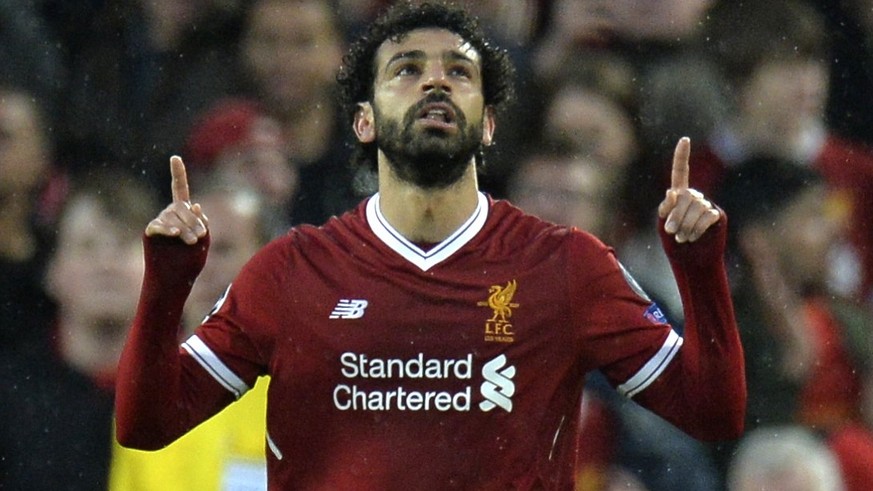 epa06690041 Liverpool&#039;s Mohamed Salah celebrates scoring the 1-0 goal during the UEFA Champions League semi final, first leg soccer match between Liverpool FC and AS Roma at Anfield, Liverpool, B ...