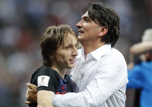 Croatia&#039;s Luka Modric celebrates with head coach Zlatko Dalic after advancing to the final during the semifinal match between Croatia and England at the 2018 soccer World Cup in the Luzhniki Stad ...