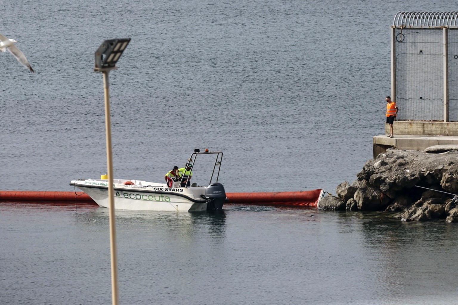epaselect epa13148245 Work continues on the installation of a floating buoy marking the jurisdictional waters off Tarajal Beach in Ceuta and separating them from Morocco in Ceuta, Spain, 03 August 202 ...