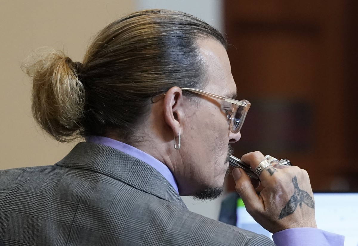Actor Johnny Depp appears in the courtroom at the Fairfax County Circuit Court in Fairfax, Va., Wednesday May 4, 2022. Depp sued his ex-wife actor Amber Heard for libel in Fairfax County Circuit Court ...