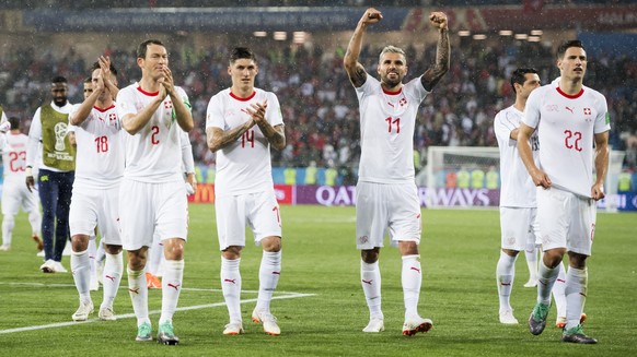 Switzerland&#039;s soccer players with Stephan Lichtsteiner, Steven Zuber, Valon Behrami, Fabian Schaer, celebrate the victory during the FIFA World Cup 2018 group E preliminary round soccer match bet ...