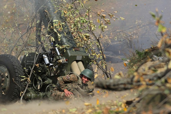 epa08761766 A picture provided by the Armenian Defense Ministry&#039;s Press Office via PAN Photo shows Armenian soldiers fire during military combat with the Azerbaijani army in the Nagorno-Karabakh  ...
