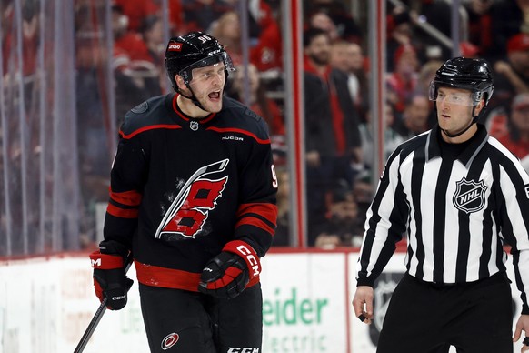 Carolina Hurricanes&#039; Mikko Rantanen (96) protests against a penalty with an official during the third period of an NHL hockey game against the Edmonton Oilers in Raleigh, N.C., Saturday, March 1, ...