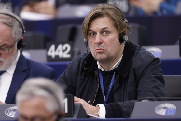 FILE - Germany&#039;s Maximilian Krah, of the far-right &#039;Alternative for Germany&#039; party, grimaces during a session at the European Parliament in Strasbourg, France, Tuesday, April 23, 2024.  ...