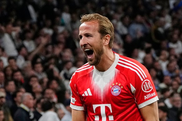 Bayern's Harry Kane celebrates scoring his side's second goal during the Champions League quarterfinal first leg soccer match between Real Madrid and Bayern Munich in Madrid, Spain, Tuesday, ...