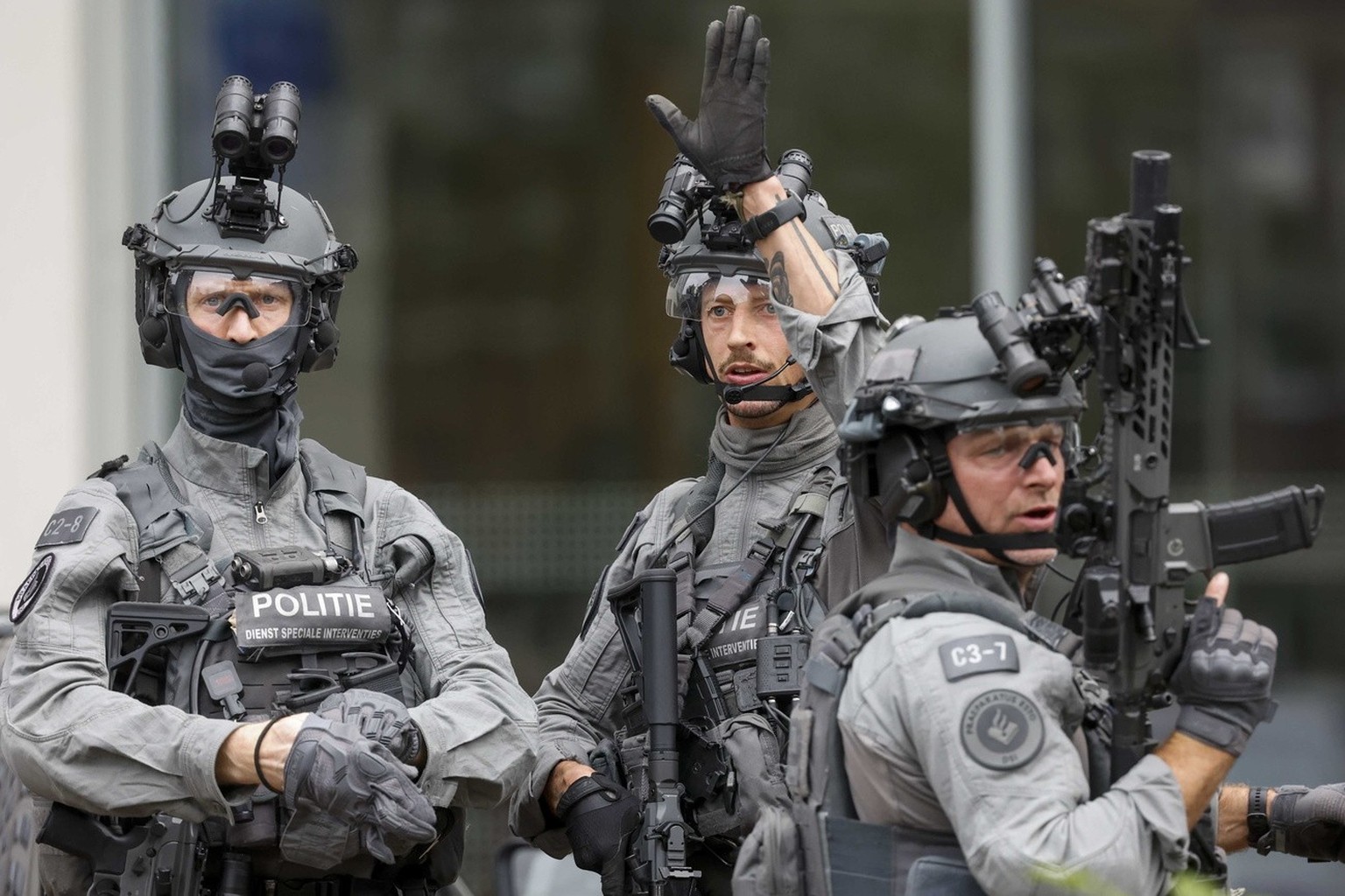 epa10887857 Police officers from the special intervention service stand outside the Erasmus MC Rotterdam hospital on Rochussenstraat, which has been cordoned off after two shooting incidents in Rotter ...