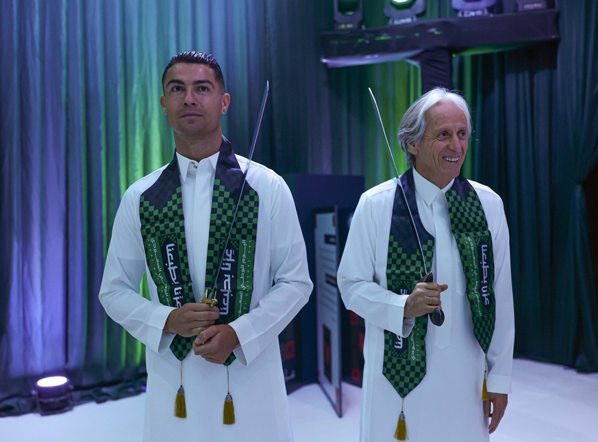 Ronaldo performs sword dance during Saudi Arabias National Day celebrations RIYADH, SAUDI ARABIA - SEPTEMBER 23: ----EDITORIAL USE ONLY - MANDATORY CREDIT - AL NASSR SAUDI CLUB / HANDOUT - NO MARKETIN ...