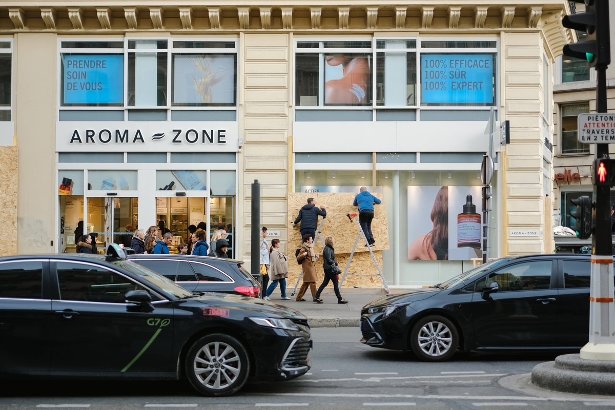 Businesses Are Boarding Up Their Windows In Paris Shopkeepers install wooden boards to barricade their shop windows in preparation for an anti-government demonstration in Paris, France, on October 22, ...