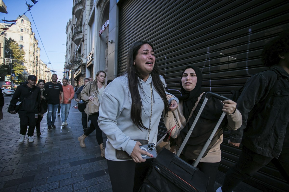 People leave the area after an explosion on Istanbul's popular pedestrian Istiklal Avenue Sunday, Istanbul, Sunday, Nov. 13, 2022. A bomb exploded on a major pedestrian avenue in the heart of Ist ...