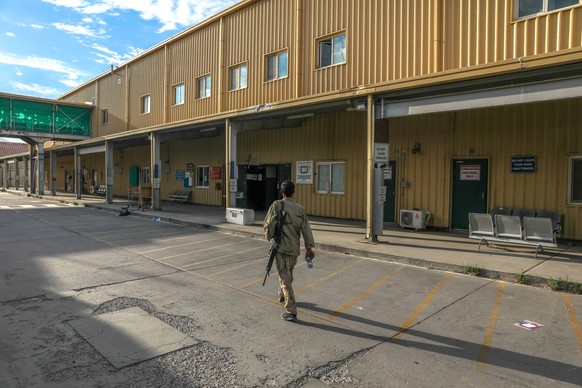 epa09324753 An Afghan army soldier walks inside the Bagram Air Base, some 50 kilometers north of the capital Kabul, Afghanistan, 05 July 2021. After nearly two decades, the US military has left the Ba ...