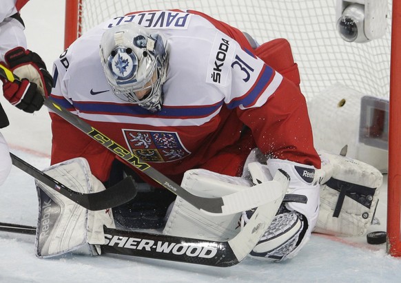 Czech Republicâs Ondrej Pavelec fails to make a save during the Hockey World Championships Group A match against Switzerland in Prague, Czech Republic, Tuesday, May 12, 2015. (AP Photo/Petr David Jo ...