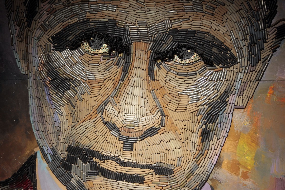 In this photo taken on Wednesday, July 22, 2015, a portrait of Russian President Vladimir Putin, made by Ukrainian artist Dasha Marchenko out of cartridge cases, is seen in the artist's studio in ...