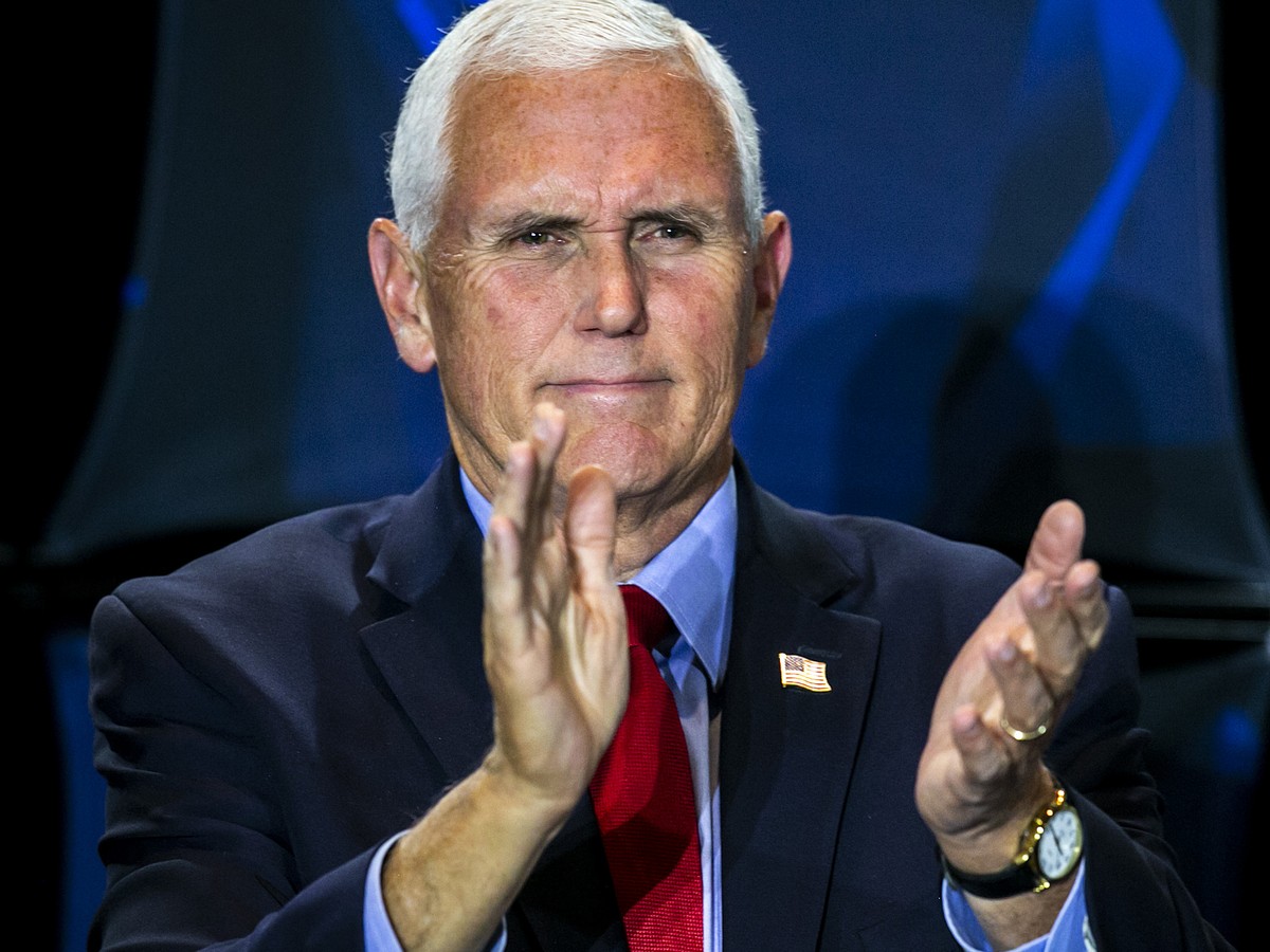 Former Vice President Mike Pence claps during the Young America's Foundation event, "How to Save America from the Woke Left," Monday, Nov. 1, 2021, at the Iowa Memorial Union on the Uni ...