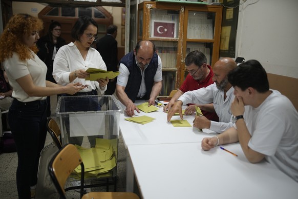 Election representatives count ballots at a polling station in Istanbul, Turkey, Sunday, May 28, 2023. Polls closed in Turkey in a runoff presidential race that will decide whether the country's ...