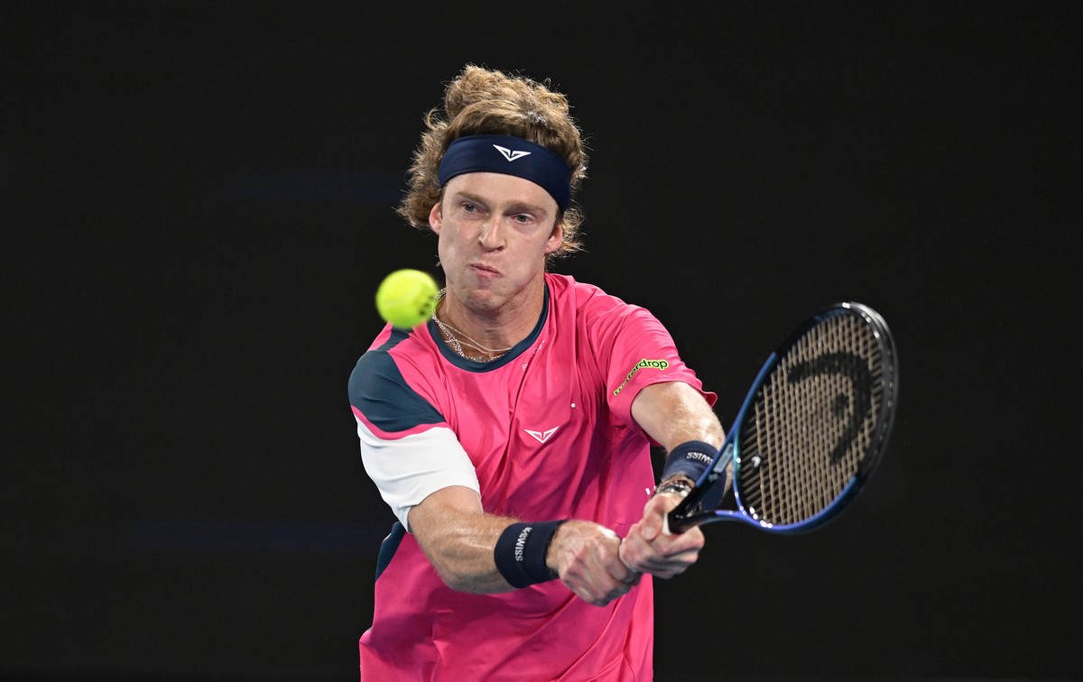 epa11823608 Andrey Rublev of Russia in action during the Men's Singles first round match against Joao Fonseca of Brazil at the Australian Open Grand Slam tennis tournament in Melbourne, Australia ...
