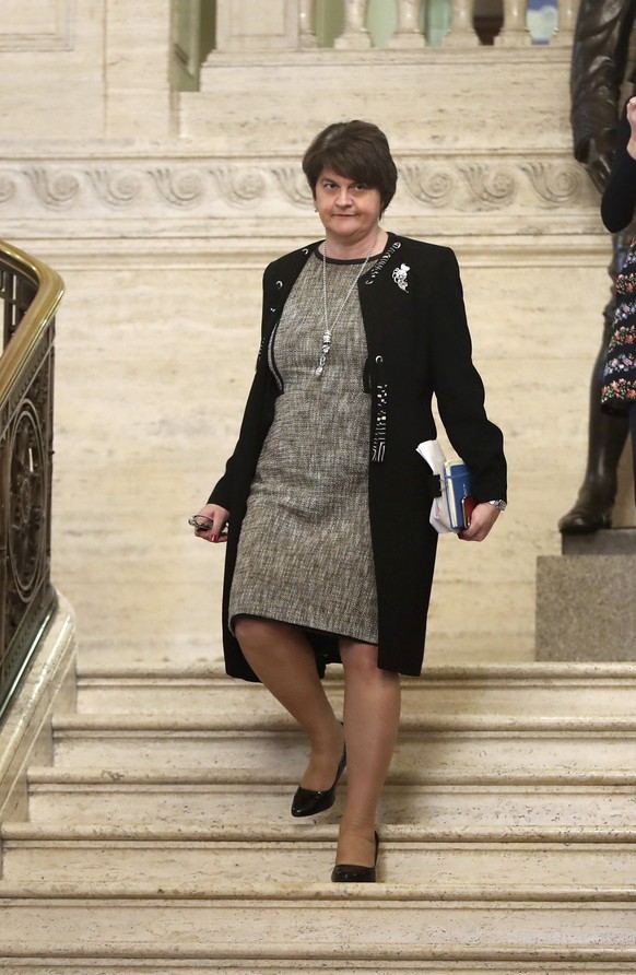 Arlene Foster descends the steps of Stormont Parliament buildings in Belfast, Northern Ireland, Monday Oct. 21, 2019. Some members of the Stormont Assembly will sit for the first time in two-and-half  ...