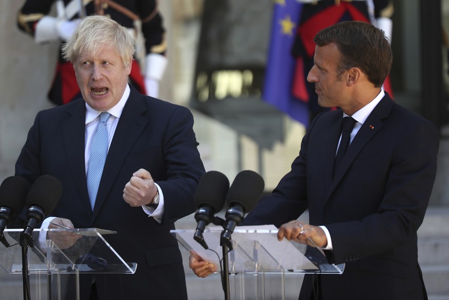 French President Emmanuel Macron and Britain&#039;s Prime Minister Boris Johnson speak to the media outside the Elysee Palace, Thursday, Aug. 22, 2019 in Paris. Welcoming British Prime Minister Boris  ...