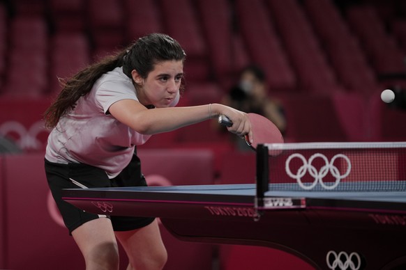 Syria&#039;s Hend Zaza competes during women&#039;s table tennis singles preliminary round match against Austria&#039;s Liu Jia at the 2020 Summer Olympics, Saturday, July 24, 2021, in Tokyo. (AP Phot ...