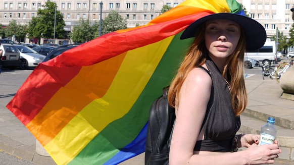 A woman take part in the Equality Parade, the largest gay pride parade in central and eastern Europe, in Warsaw, Poland, Saturday June 19, 2021. The event has returned this year after a pandemic-induc ...