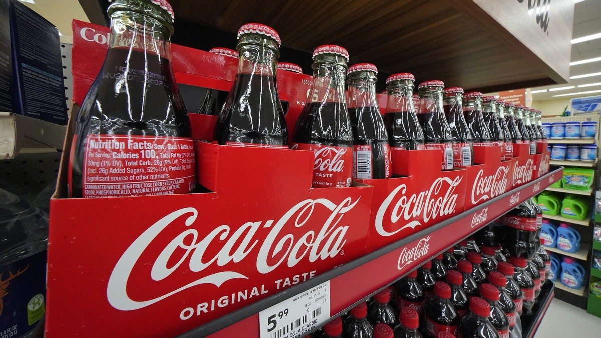 Bottles of Coca-Cola are on display at a grocery market in Uniontown, Pa, on Sunday, April 24, 2022. Coca-Cola raised prices to offset inflation and on Tuesday, Feb. 14, 2023, it said that it didn ...