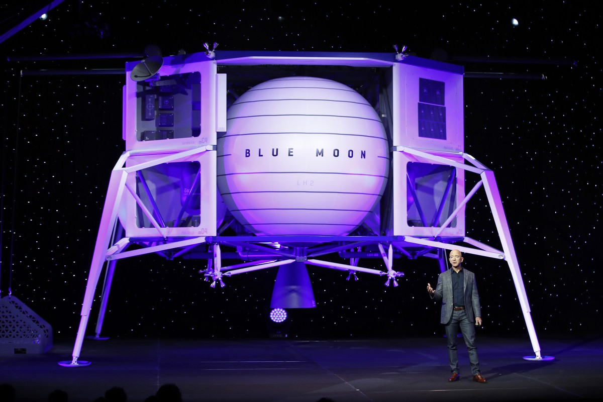 Jeff Bezos speaks in front of a model of Blue Origin's Blue Moon lunar lander, Thursday, May 9, 2019, in Washington. (AP Photo/Patrick Semansky)