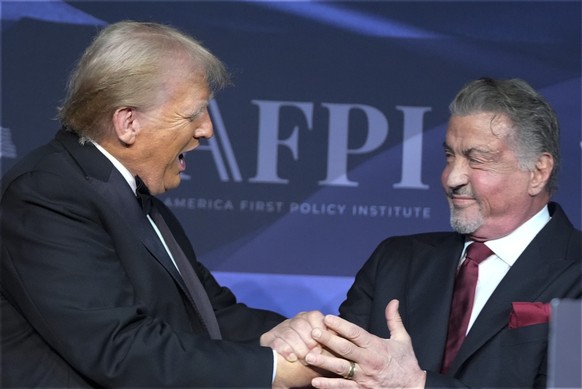 President-elect Donald Trump greets actor Sylvester Stallone during an America First Policy Institute gala at his Mar-a-Lago estate, Thursday, Nov. 14, 2024, in Palm Beach, Fla. (AP Photo/Alex Brandon ...