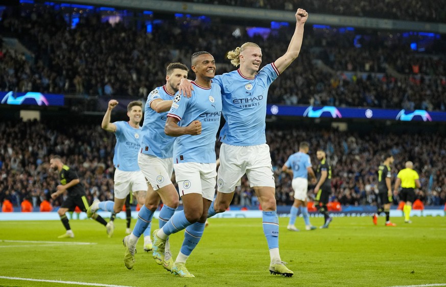 Manchester City&#039;s Erling Haaland, Manuel Akanji, and Ruben Dias, from right, celebrate their third goal during the Champions League semifinal second leg soccer match between Manchester City and R ...