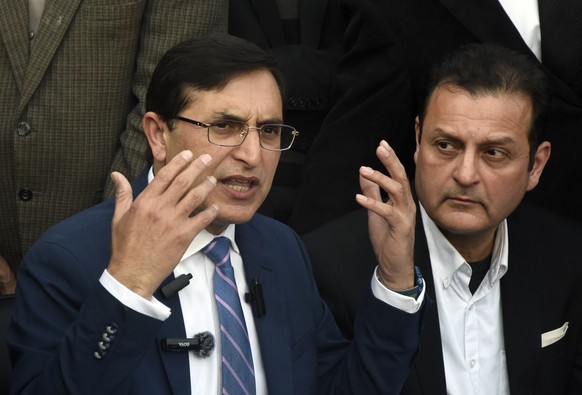 Gohar Khan, left, chairman of Pakistan Tehreek-e-Insaf (PTI) speaks during a press conference in Islamabad, Pakistan, Saturday, Feb. 10, 2024. On Saturday, PTI chairman Gohar Khan accused authorities  ...
