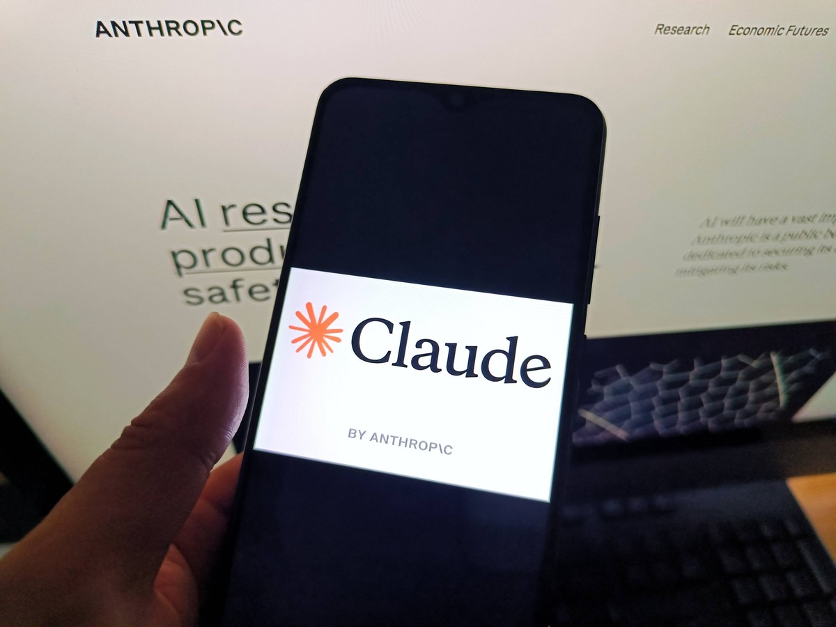 Claude by Anthropic SUQIAN, CHINA - MAY 6, 2026 - A netizen is checking the Claude by Anthropic logo on his mobile phone and the Claude by Anthropic webpage on his computer in Suqian City, Jiangsu Pro ...
