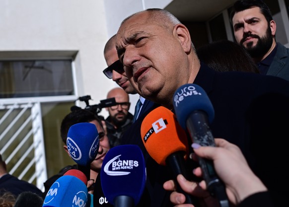 epa10555381 Leader of the GERB party Boyko Borissov speaks to the press outside a polling station after voting in the parliamentary election in Sofia, Bulgaria, 02 April 2023. Bulgaria is holding its  ...