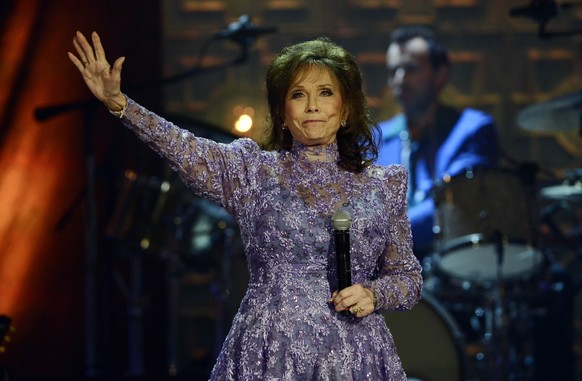 FILE - Loretta Lynn waves to the crowd after performing during the Americana Music Honors and Awards show Wednesday, Sept. 17, 2014, in Nashville, Tenn. Lynn, the Kentucky coal miner
