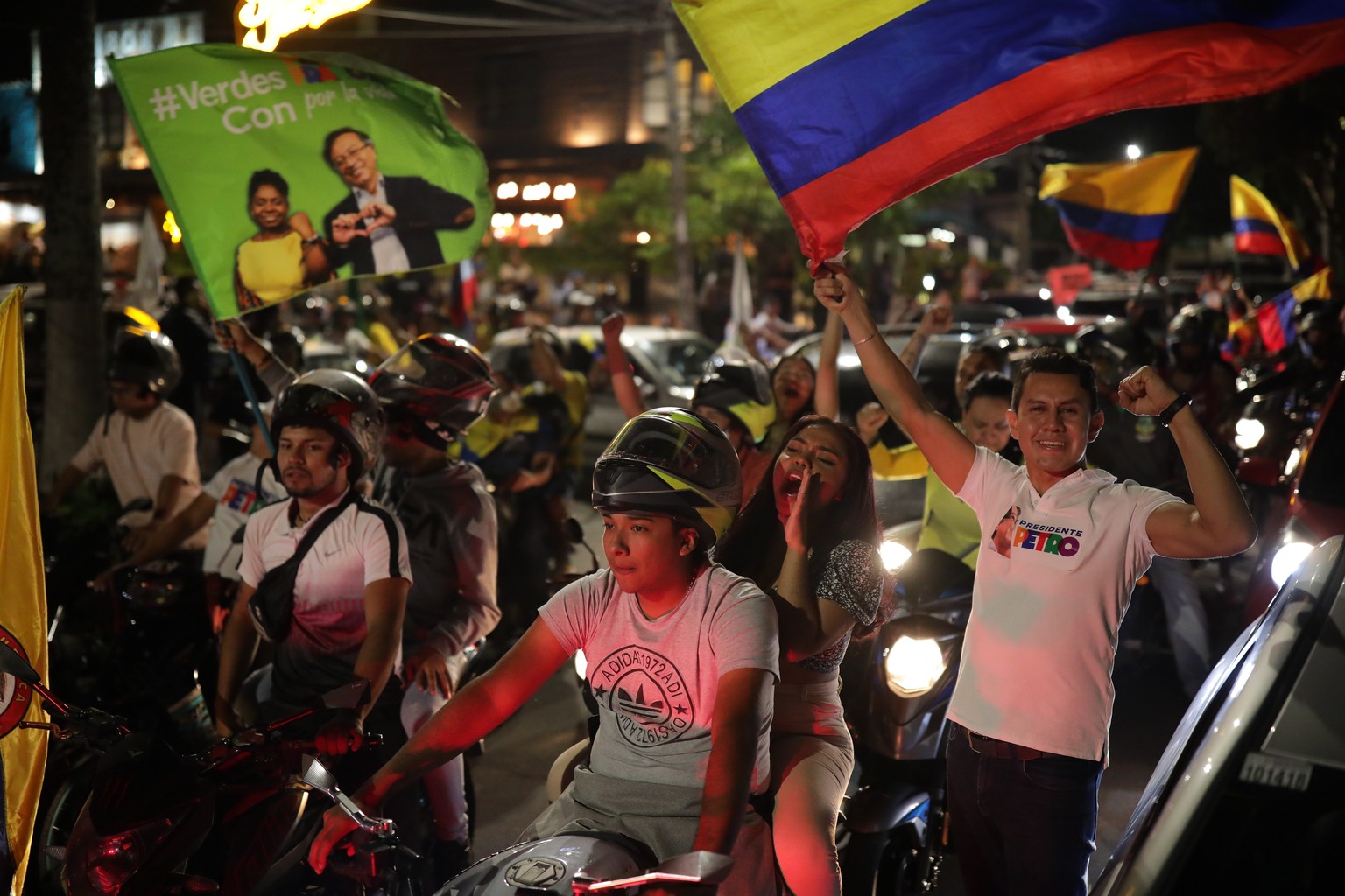 Supporters celebrate after former rebel Gustavo Petro won a runoff election in Bucaramanga, Colombia, Sunday, June 19, 2022. (AP Photo/Ivan Valencia)