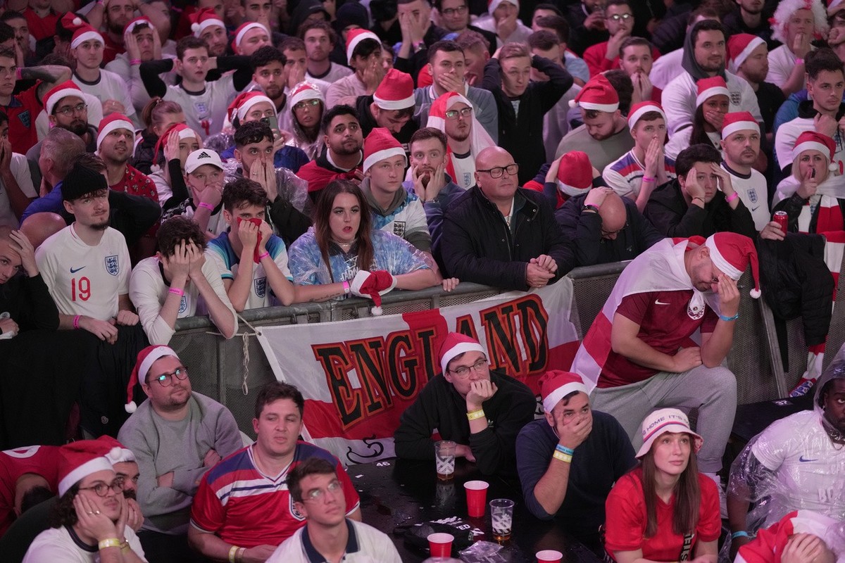 England fans react after the end of the World Cup quarterfinal match between England and France at a fan zone in London, Saturday, Dec. 10, 2022. France won the match 2-1. (AP Photo/Kin Cheung)